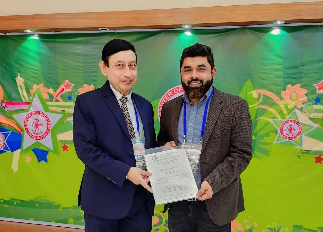WFUMB Center of Education, Bangladesh — receiving the certificate